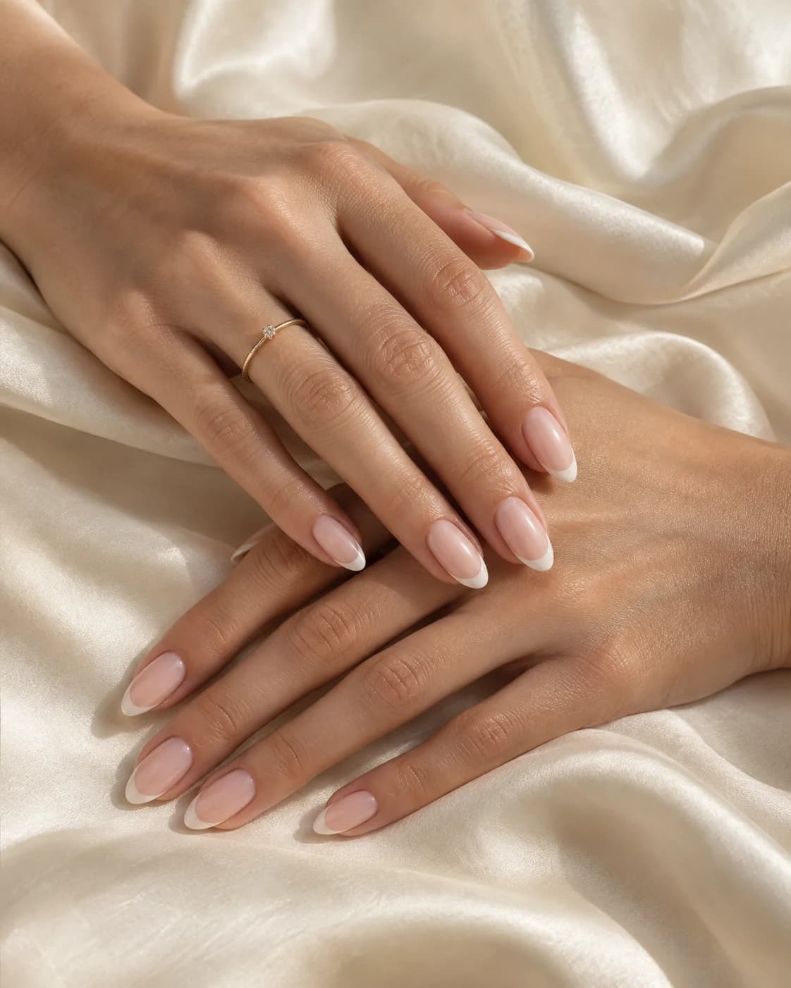 French manicure inspiration with delicate ivory tips and a sheer pink base